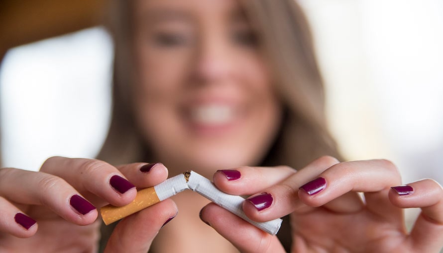 woman breaking cigarette habit