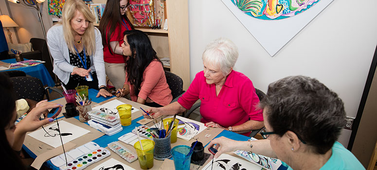 Guests enjoy crafting art at the Arts in Medicine Studio on the Magnolia Campus.