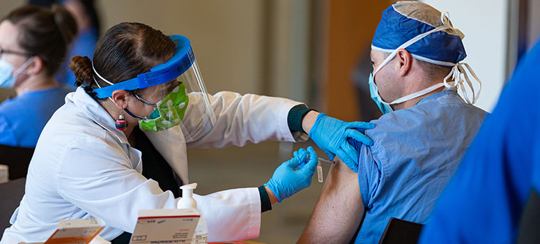 Team members were among the first to receive the COVID-19 vaccine when it became available. 