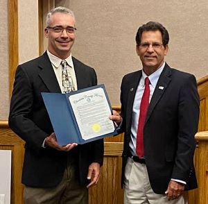 Charlotte County Commissioner presents Moffitt's Dr. Ricardo Gonzalez with a Sarcoma Awareness Month proclamation