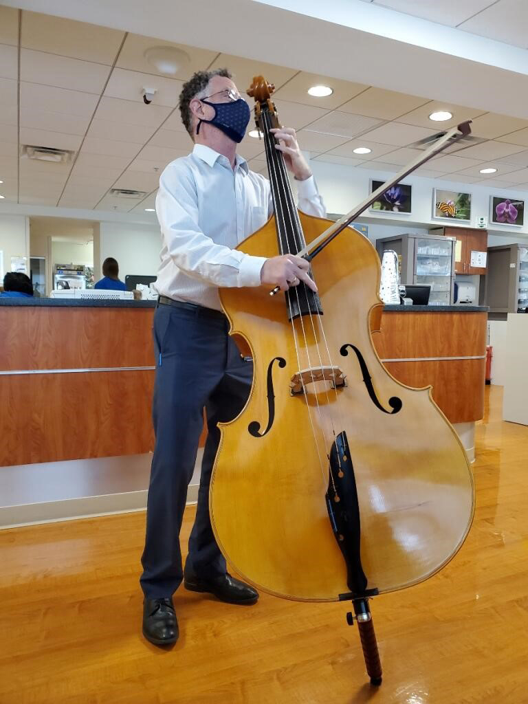 Photo of Lloyd Goldstein playing the upright bass