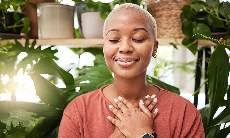woman meditating with eyes closed