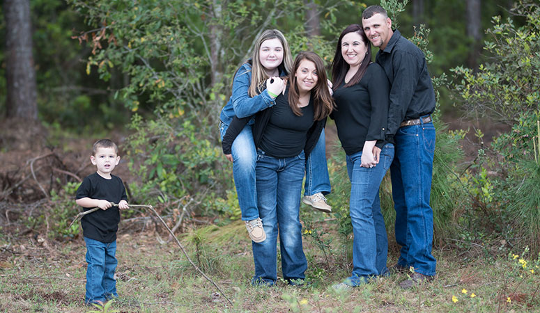 Morel, right, poses with her family