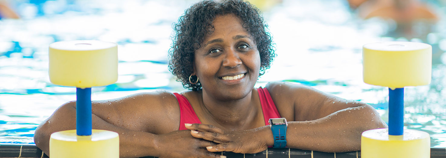 woman in pool during water aerobics