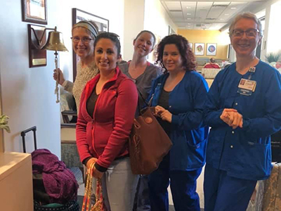 Michelle Chador rings the bell after treatment