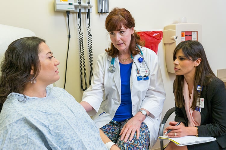 An interpreter assists a nurse in the clinic
