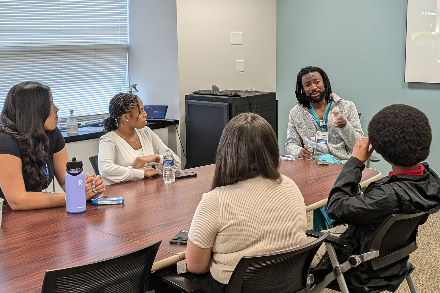 DICR interns listen to a guest speaker