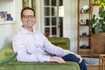 Dr Poncy sitting in his office