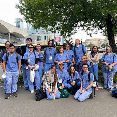 Grenier and Sweeney (front row center) worked with Polish doctors and other nurses to treat Ukrainian refugees.