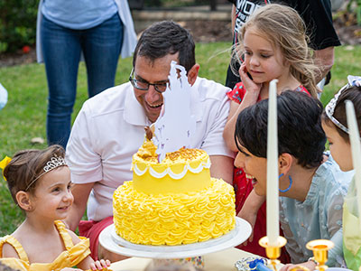 Madison Losito blows out the candles on her cake at her third birthday party.
