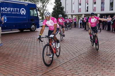 Cure on Wheels cyclists riding into Capitol courtyard
