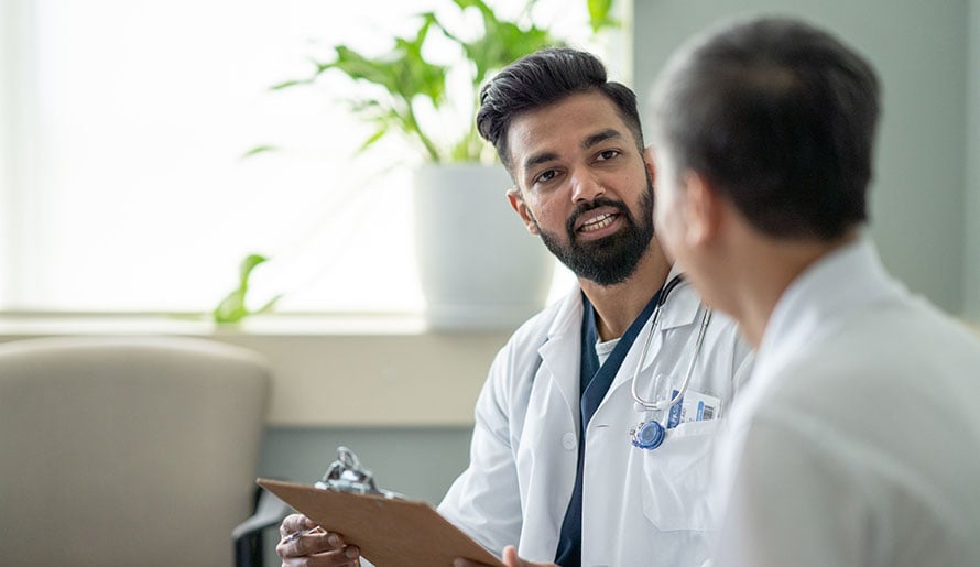 Doctor discussing high-intensity focused ultrasound with a patient