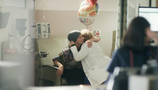 female patient in infusion center receiving chemotherapy