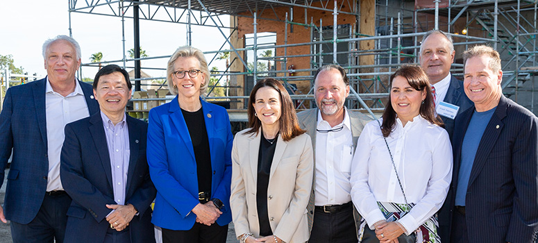 image of leaders at topping out ceremony