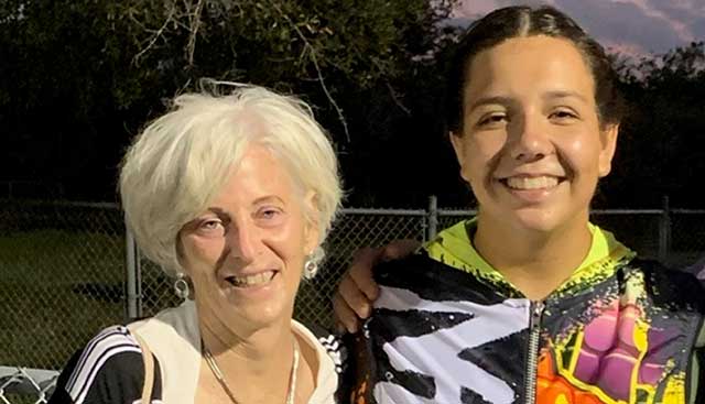 Happy mother posing with smiling young daughter 