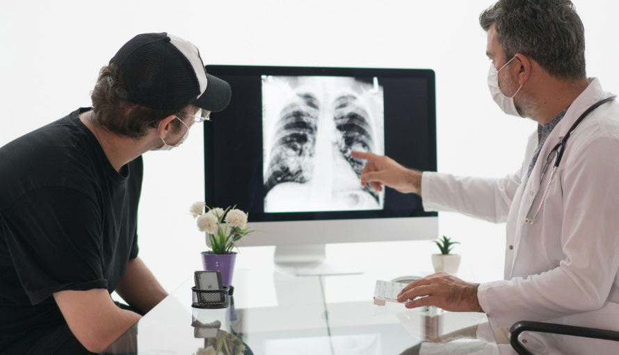 a doctor reviews a x-ray with a patient