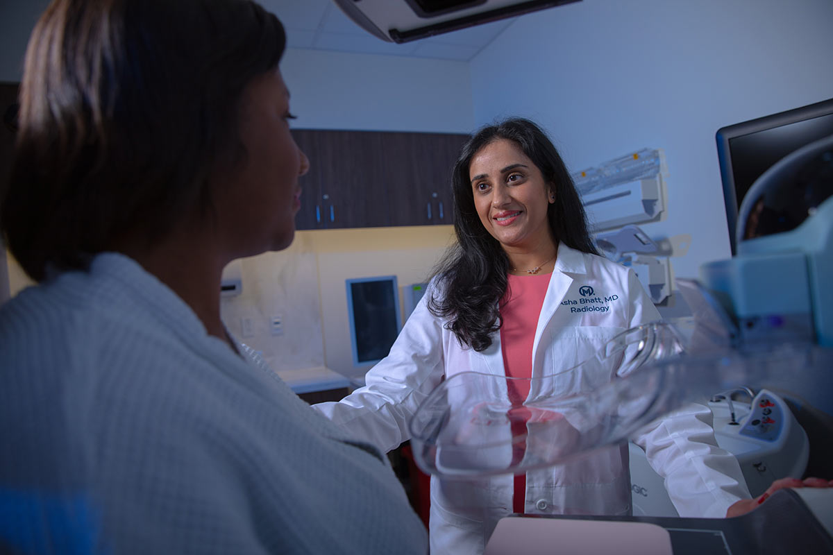 a Moffitt radiologist with a patient
