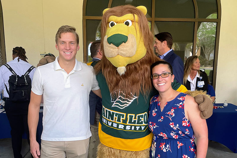 Moffitt team members pose with Saint Leo mascot