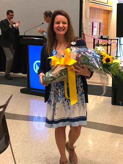 2019 APP of the Year Linda DeZago pictured holding the award and flowers
