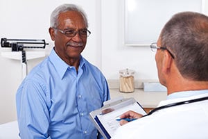 Patient discussing risk factors of esophageal cancer with a physician