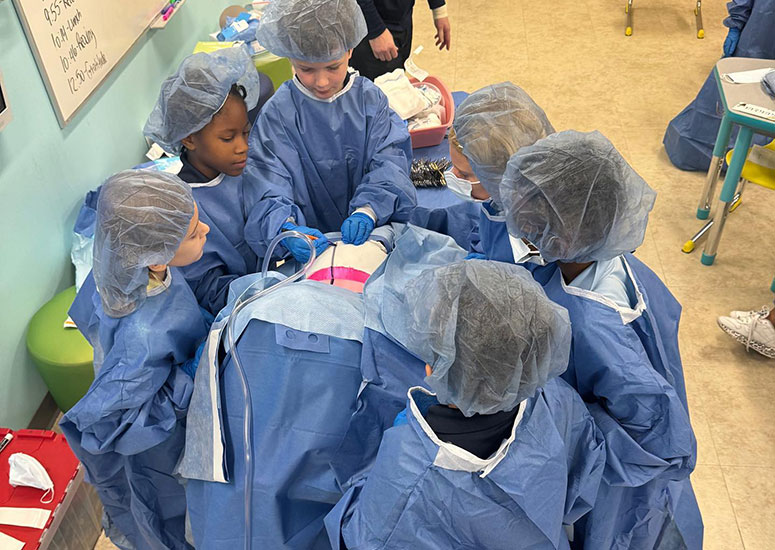 The OR team preps the patient to have a kidney surgically removed.