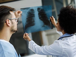 Doctors looking at lung scan