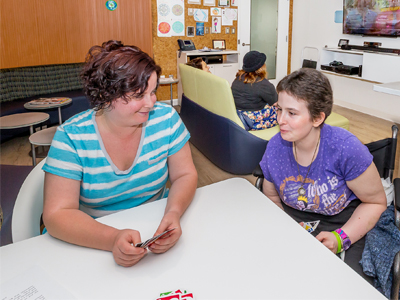 Photo of two patients in the Moffitt AYA Lounge