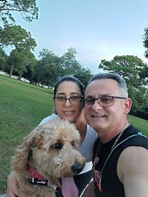 Martinez and his wife hang with pup Mia.