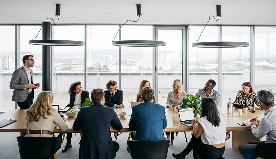 Members of the Administrative Residency Program at a table
