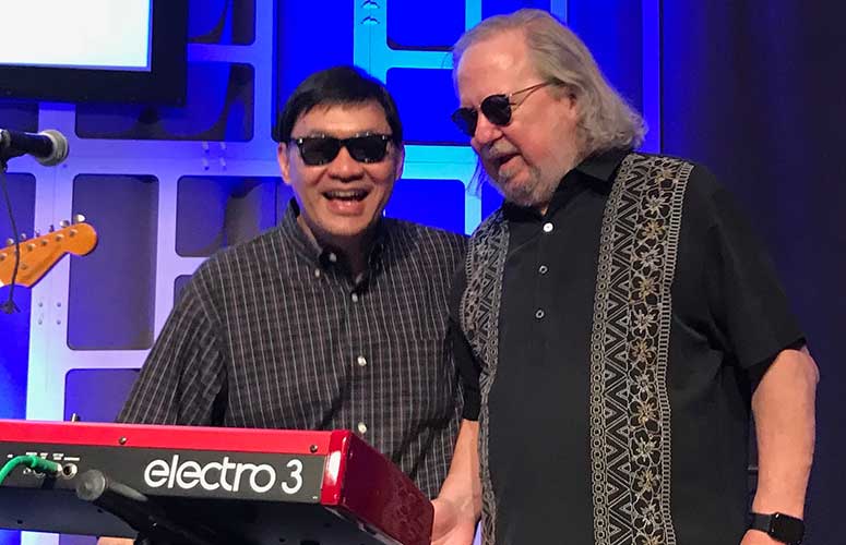 Hwu on the keyboard, pictured with bandmate and colleague Dr. James (Jim) Allison