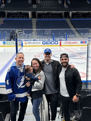 Reed Nichols and his family watch a recent Tampa Bay Lightning morning practice.