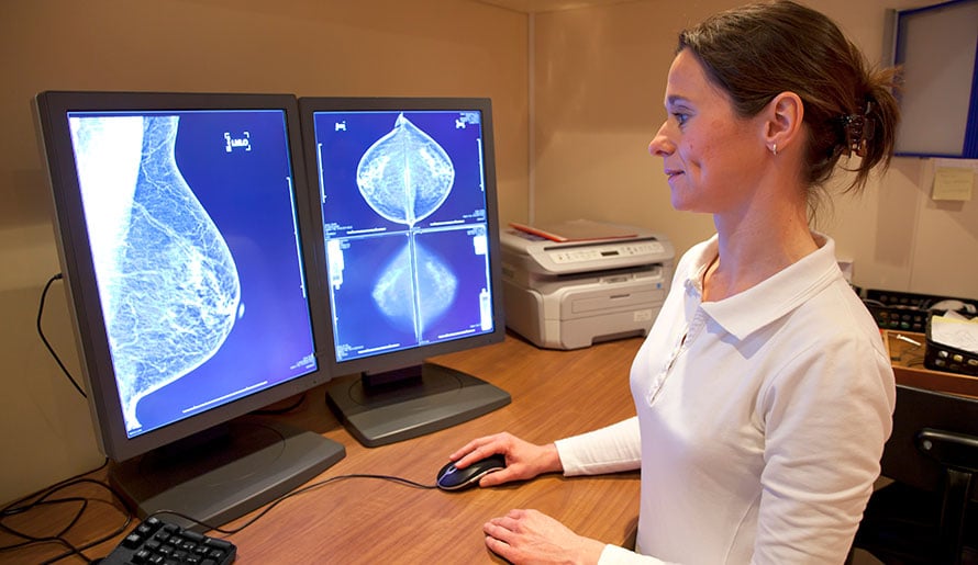 Radiologist looking at breast images