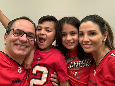 Dr. Daniel Anaya poses with his wife, Dr. Pilar Suz, and their twins, Lucas and Daniela.