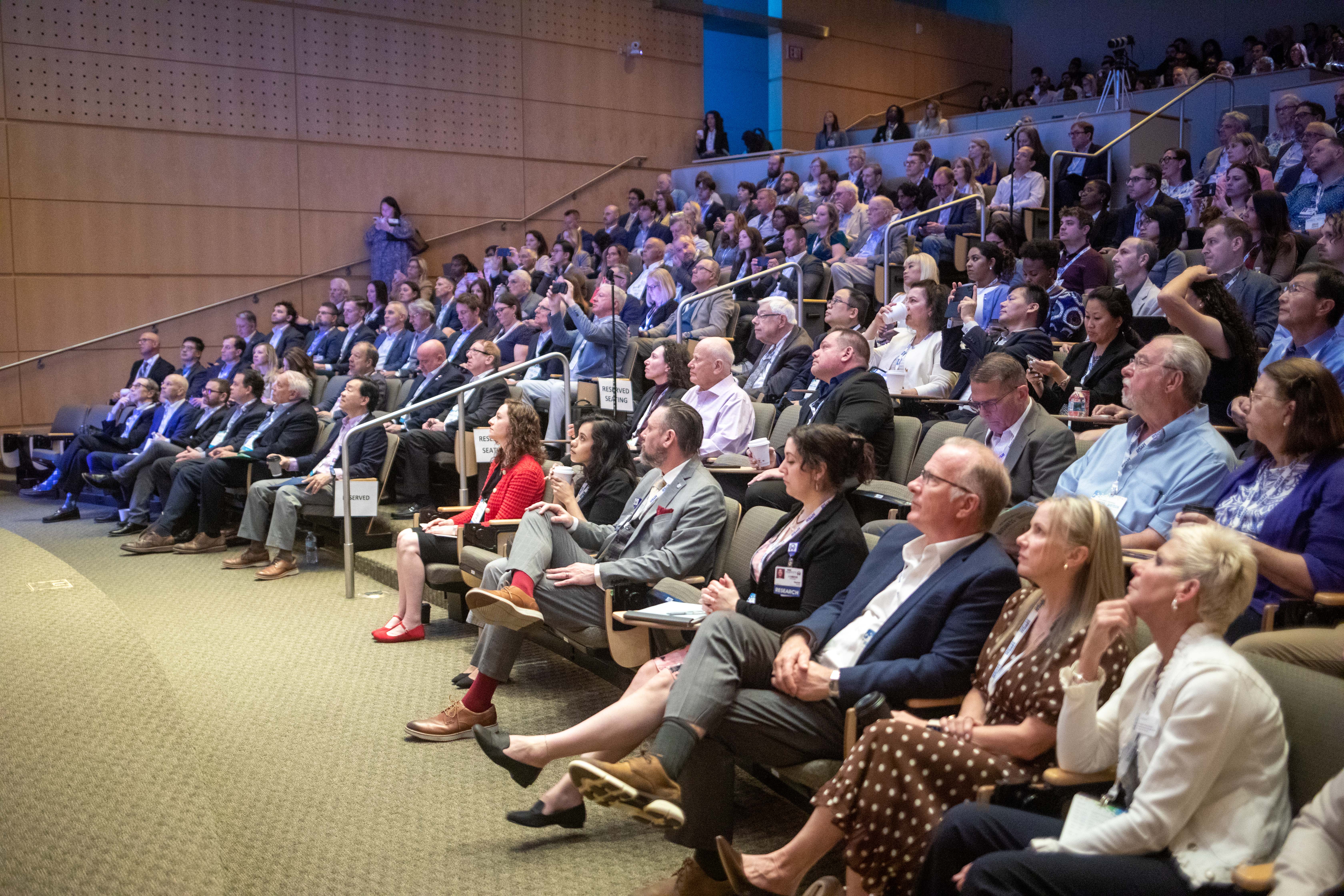 large crowd sitting in Moffitt's Ted Couch Auditorium
