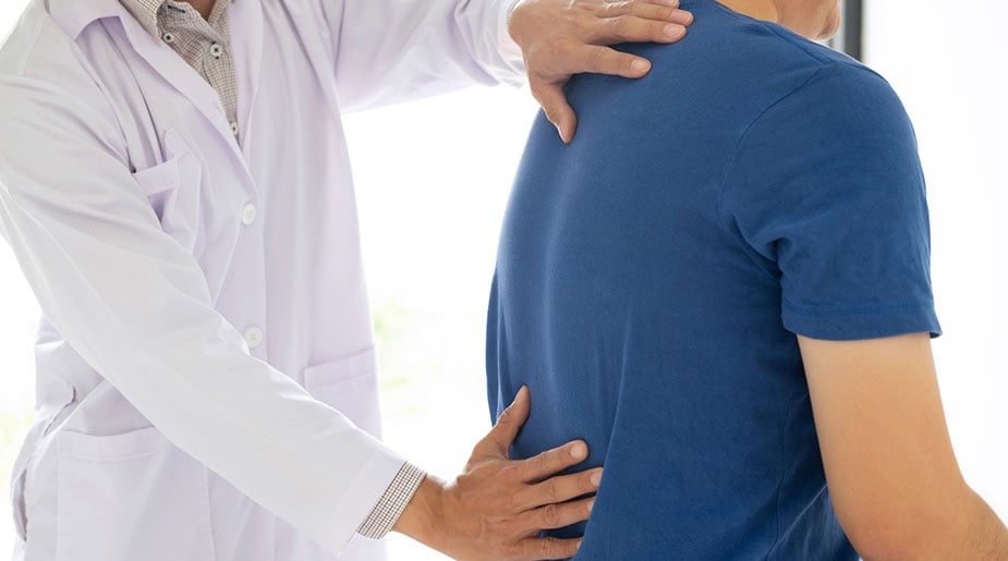 patient with back pain, cause of spinal tumor