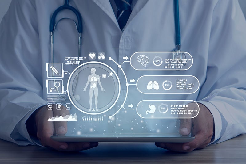 AI researcher in front of screen with data points