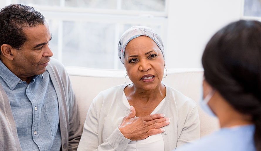 couple discussing colon cancer with doctor