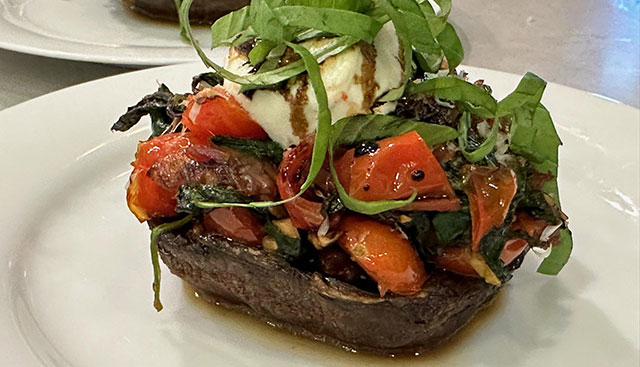 Spinach, tomato and goat cheese stuffed portobello mushroom