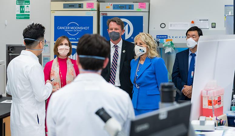 From left, U.S. Rep. Kathy Castor, former NCI Director Ned Sharpless, first lady Dr. Jill Biden and Moffitt President and CEO Dr. Patrick Hwu tour a lab at Moffitt Cancer Center in February.
