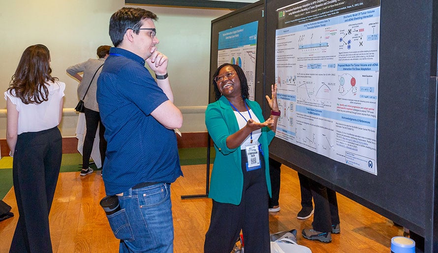 A poster presenter at the Scientific Symposium