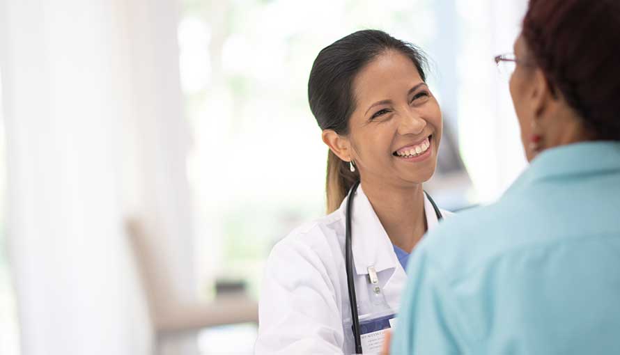 Lung cancer doctor with patient in Ft Myers