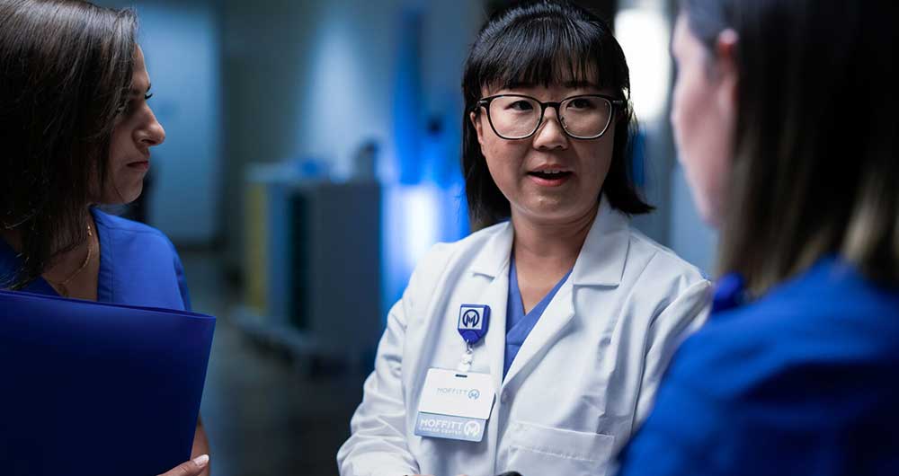 Dr. Alice Yu talks with Moffitt nurses