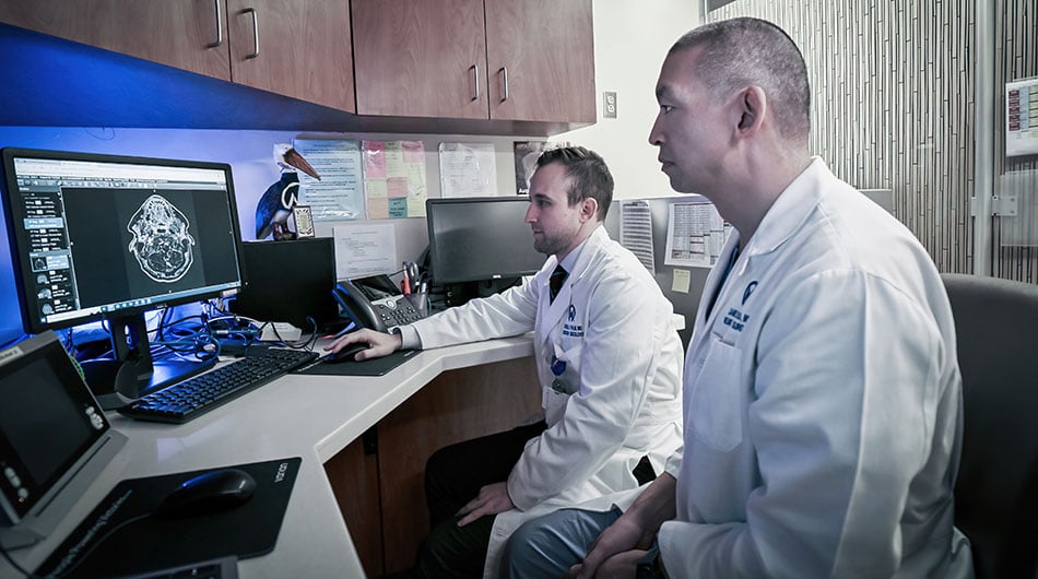 Radiation therapists look at brain scans