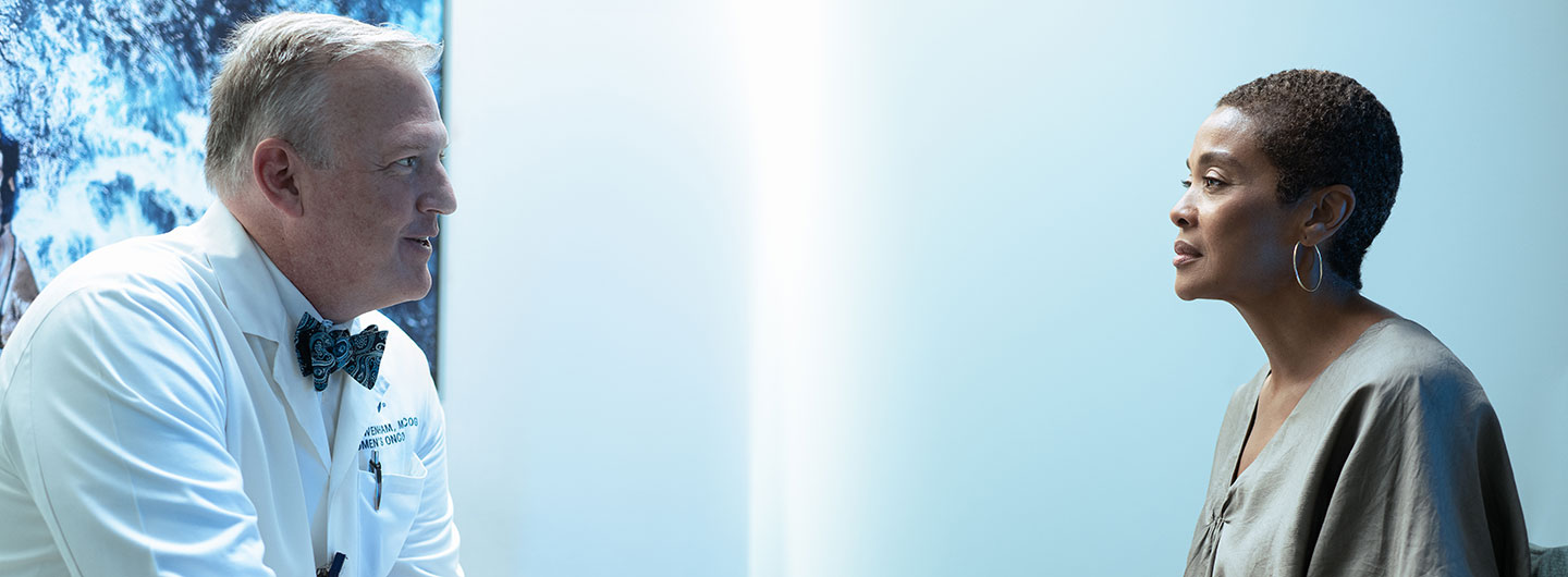 Dr. Robert Wenham speaks with a patient