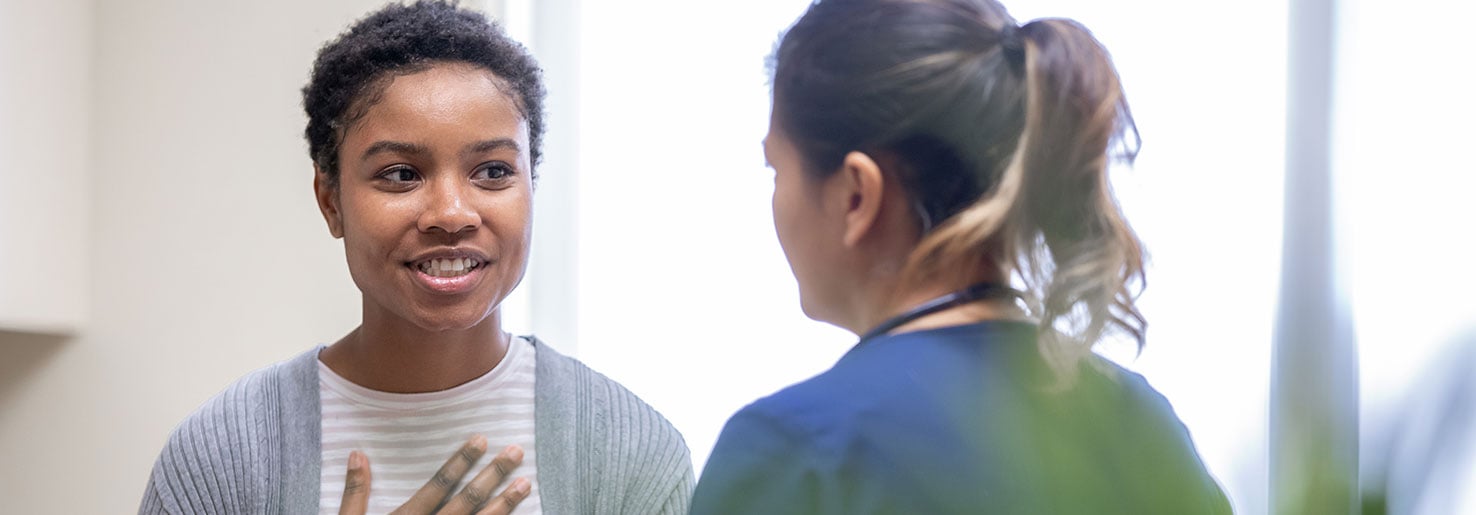 Young female with a GYN cancer talking to nurse