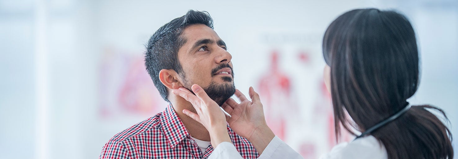 Nurse checking patient's lymph nodes