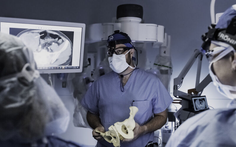 Dr. John Mullinax with 3D print of bone showing sarcoma