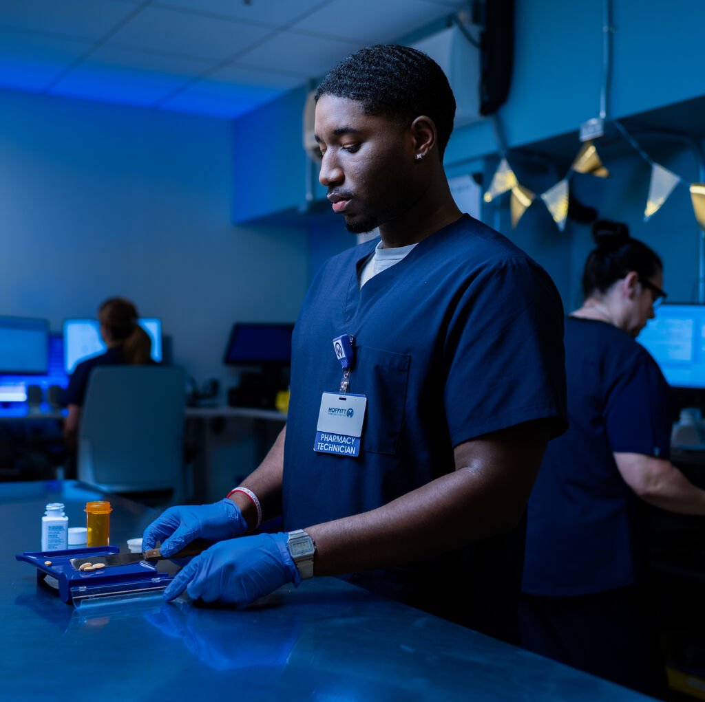 pharmacy technician measuring medication