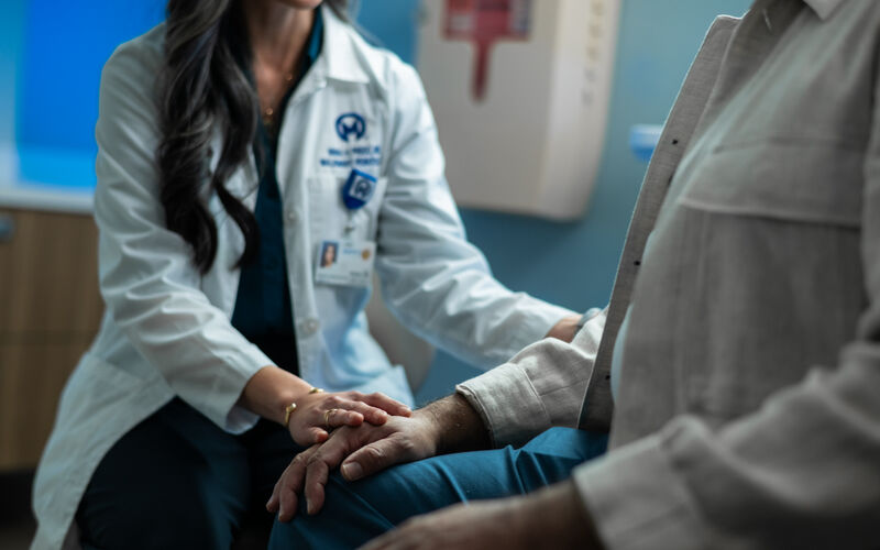 Doctor comforting a patient
