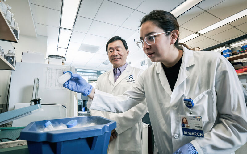 Dr. Patrick Hwu and a researcher in immunotherapy lab